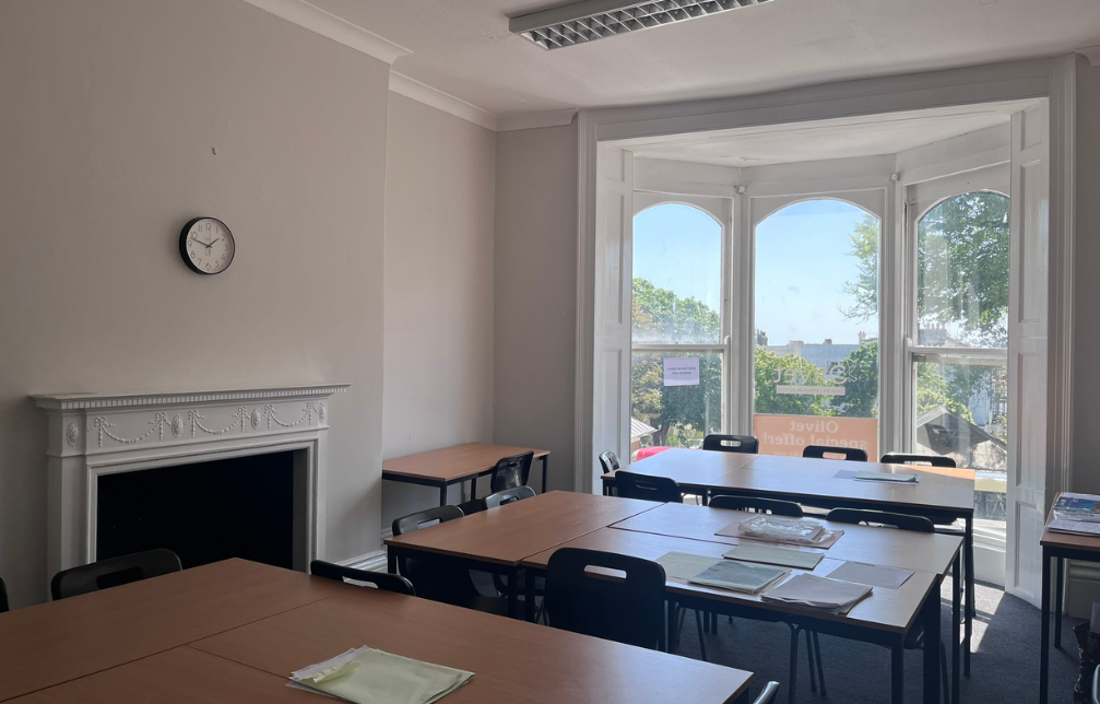Brighton classroom with brown desks and black chairs